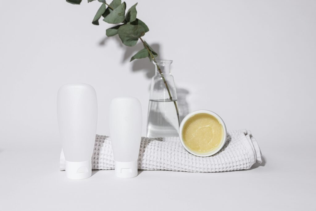 pexels-photo-8015894-8015894 Elegant presentation of bathroom bottles with eucalyptus on a white background.